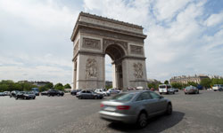 Cars driving by the Arc de Triomphe in France